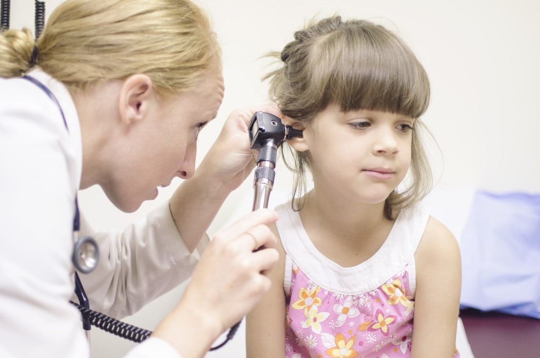Doctor checking childs health