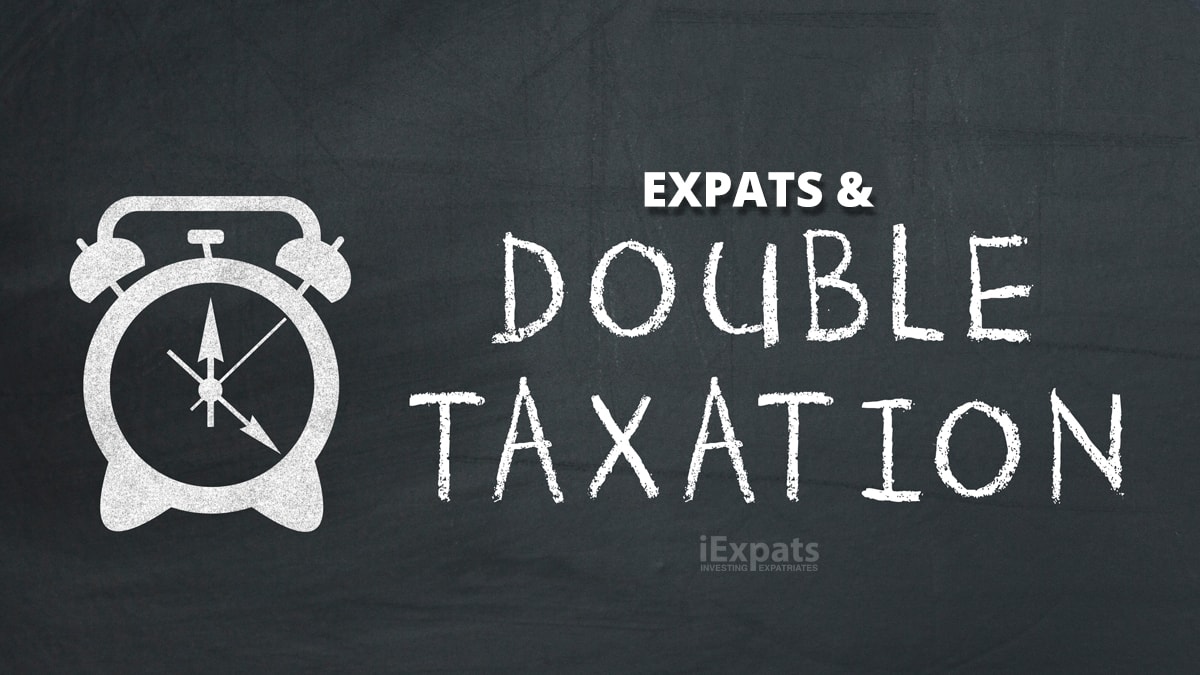 expats and double taxation written on a black board