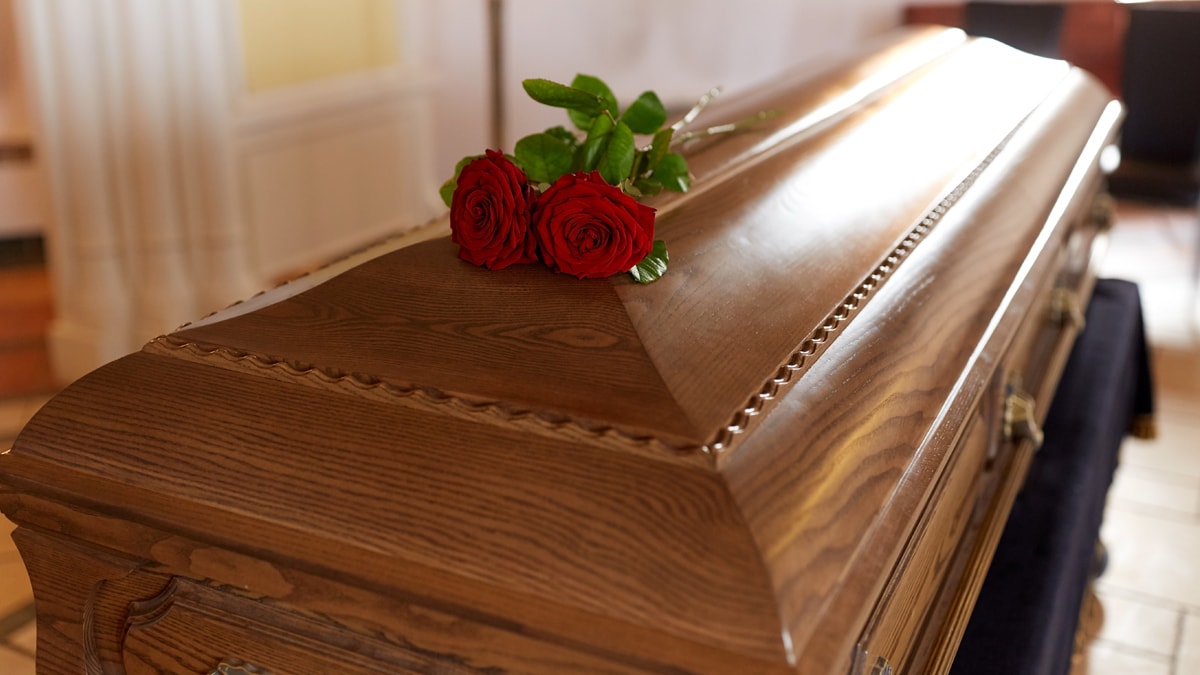 coffin with red roses