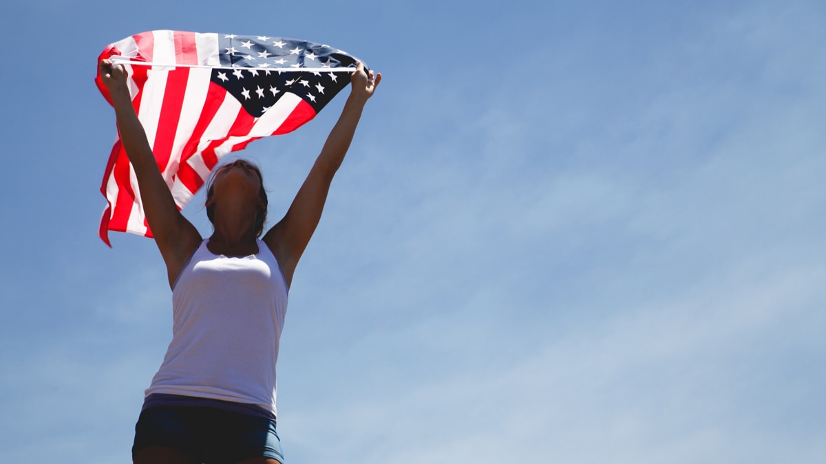 American lady waving the USA flag